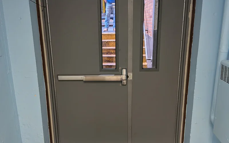 Commercial double doors with panic bar hardware